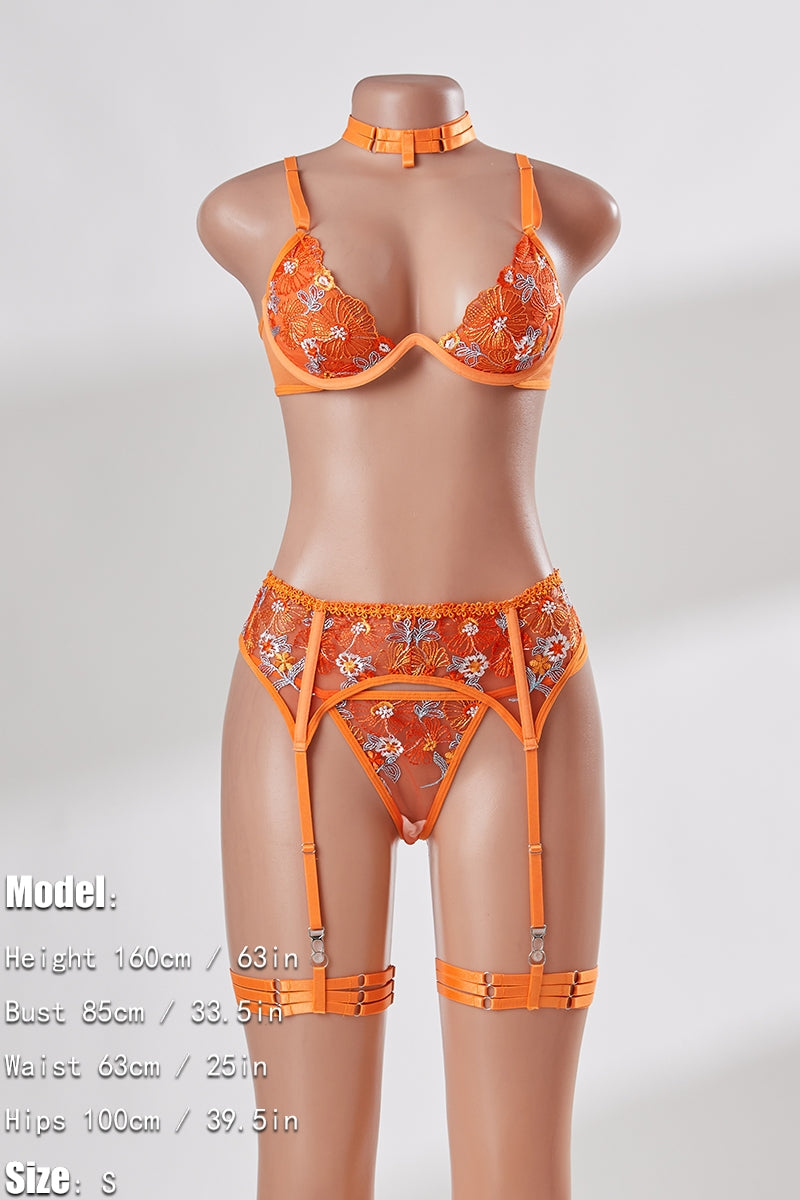Orange lingerie set on a mannequin against a white background