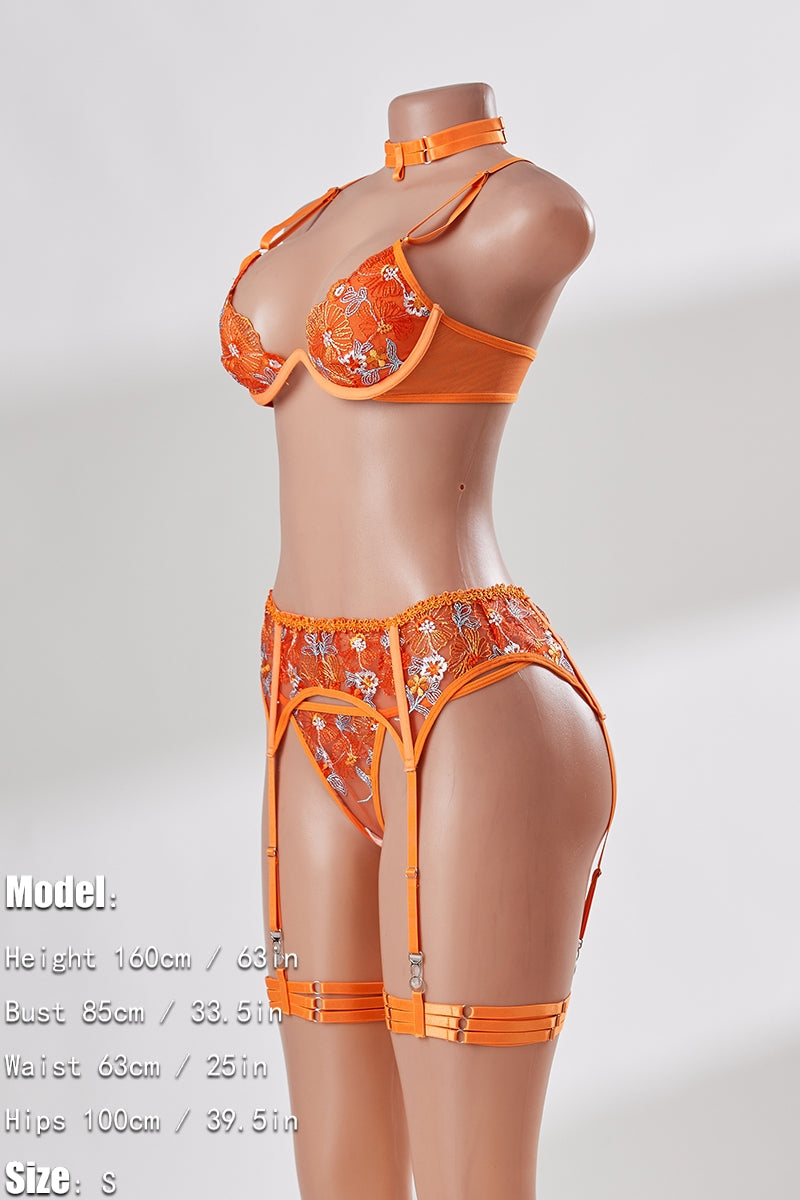 Orange lingerie set on a mannequin against a white background