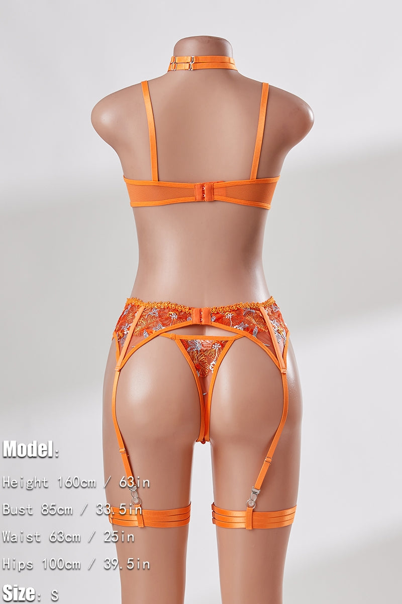 Orange lingerie set on a mannequin against a white background